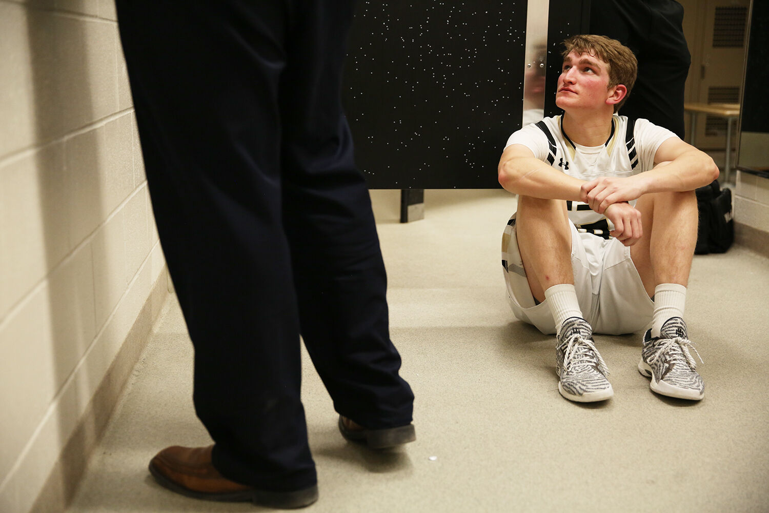 Taylor Swanston looks up at the white board